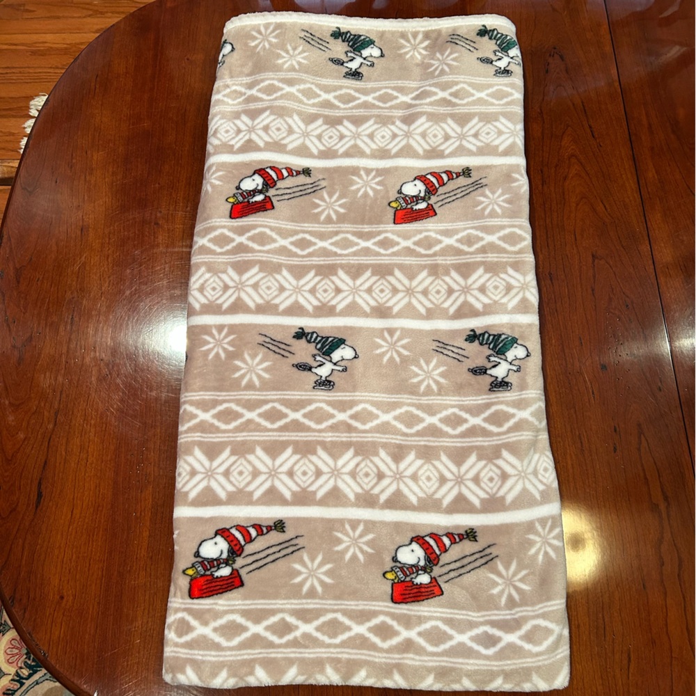 Berkshire Peanuts Tan and White Sledding Snoopy Christmas Plush Blanket